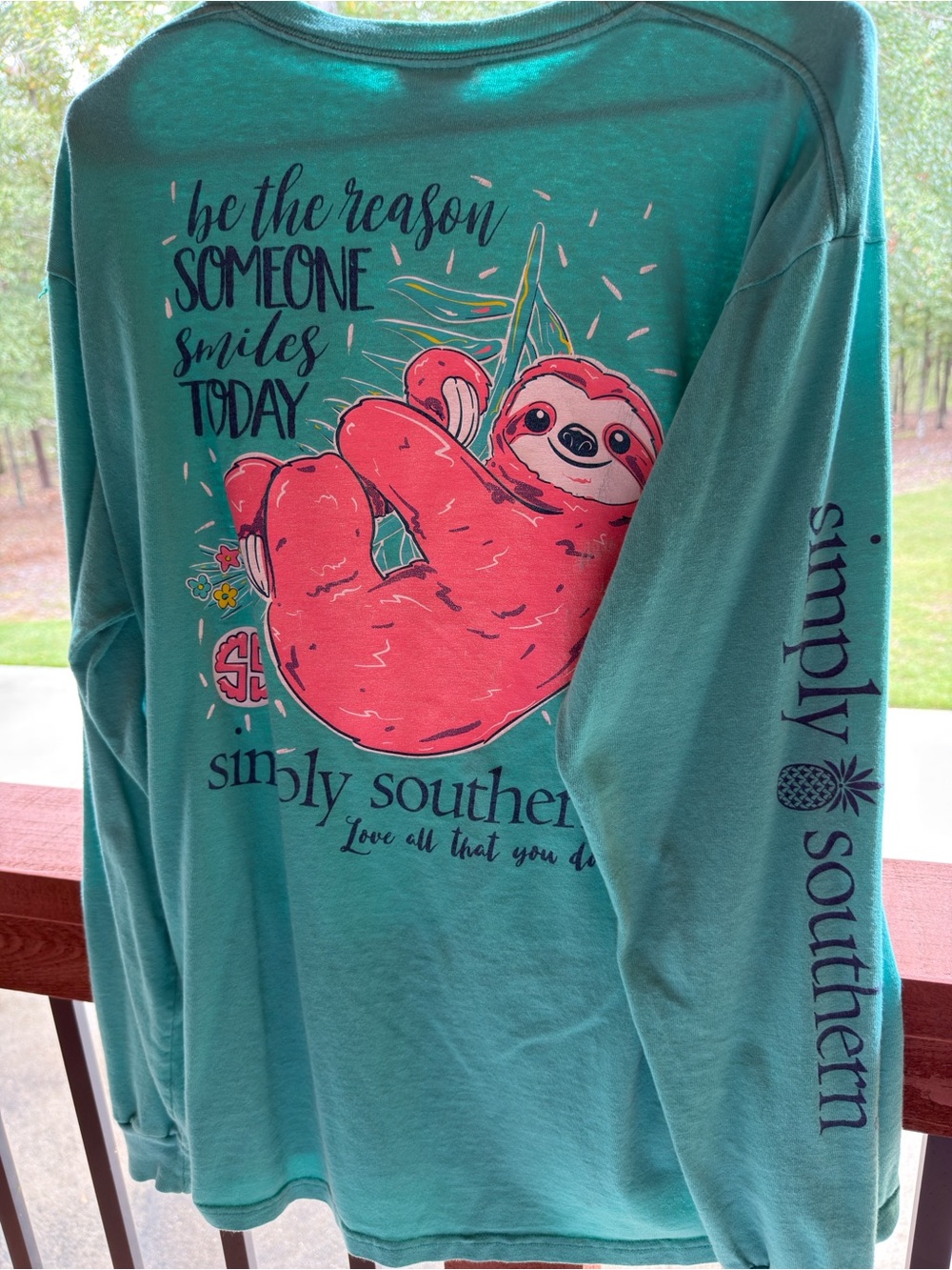 Simply Southern women’s Teal Long-Sleeve Shirt with Pink Sloth Graphic.